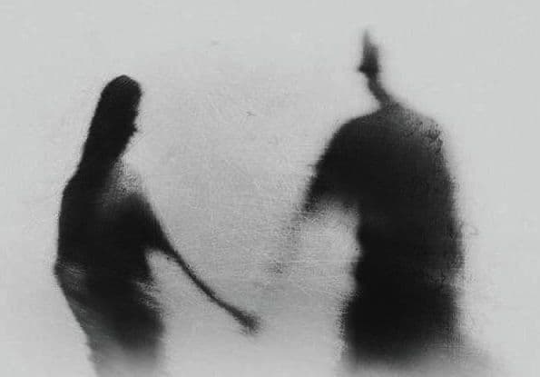 a woman holding a man's neck - Genuine Lies